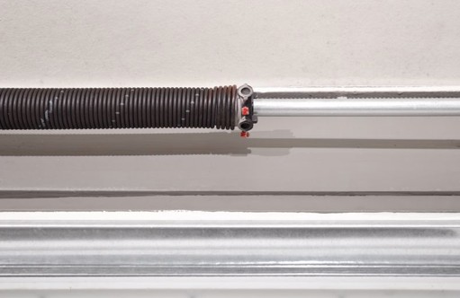 Garage door torsion spring assembly